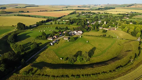 Getty Images The entire henge completely encircles the tiny village of Avebury (Credit: Getty Images)