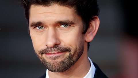 Ben Whishaw smiling at the No Time To Die World Premiere.