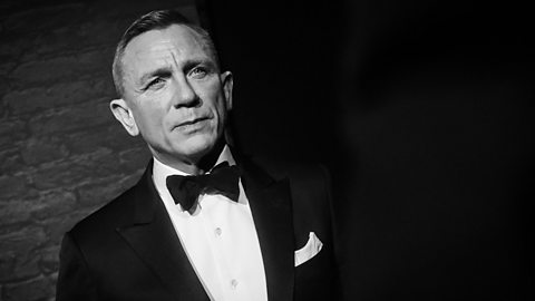 Daniel Craig in a tuxedo at a James Bond event. 