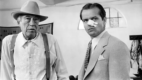 Alamy John Huston (pictured left, with Jack Nicholson) plays corrupt and depraved businessman Noah Cross (Credit: Alamy)