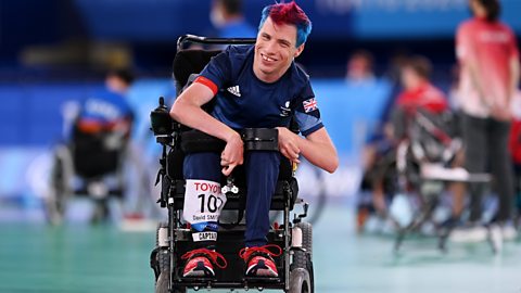 David Smith smiling as he competes in a boccia match at the Paralympics