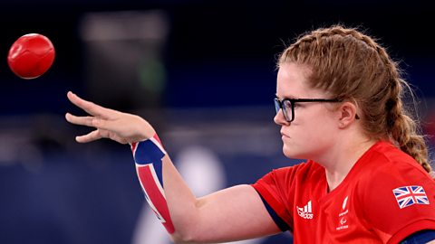 Claire Taggart throwing a boccia ball at the Paralympics