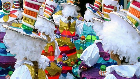 Carnival performers dressed in colourful costumes