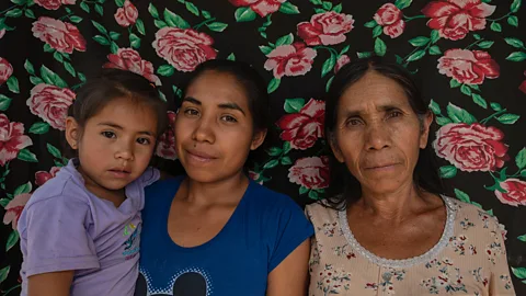 Stephania Corpi Arnaud Juana Jarquin poses for a portrait alongside her daughter-in-law and granddaughter, all of whom are members of Grupedsac (Credit: Stephania Corpi Arnaud)