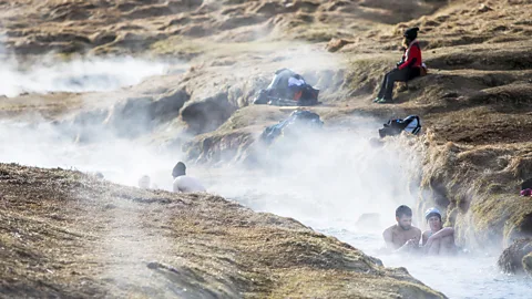 Getty Images The most insider Icelandic outdoor experience is going for a hike and then swim in the smoky Rekyjadalur Valley (Credit: Getty Images)