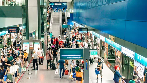 Alamy Commuters in Singapore benefit from less payments and real-time data (Credit: Alamy)
