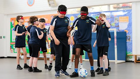 Group of children playing blind football