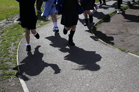 Primary school children running.