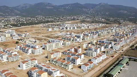 Getty Images The Athens 2004 village's legacy has been called into question, with only half the apartments created from it now occupied (Credit: Getty Images)