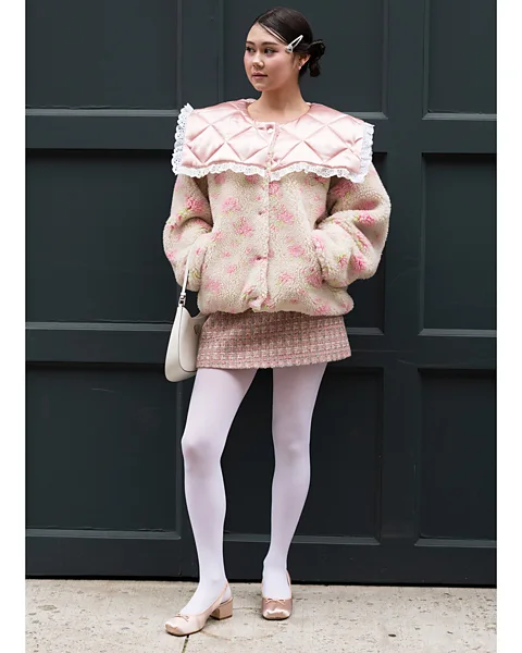 Getty Images The coquette aesthetic is based around ultra-girly styling in shades of pink and ivory (Credit: Getty Images)