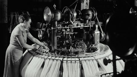 Woman working on loom, 1920s.
