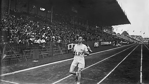 Getty Images British athlete Ernie Harper crosses the finish line of the 1924 Paris Olympics cross-country race (Credit: Getty Images)