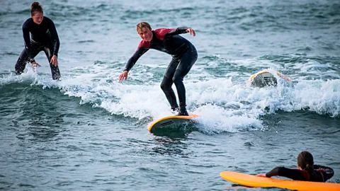 Getty Images Surfers on Denmark's north-west coast (Credit: Getty Images)