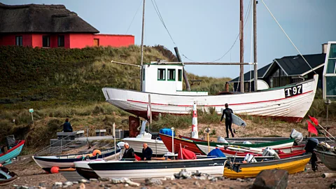 Getty Images Klitmøller's fishing past can still be seen throughout the town (Credit: Getty Images)