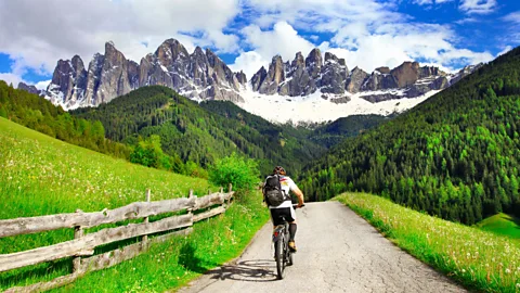 Alamy With its endless outdoor adventures and cool summer temps, the Dolomite mountains are a premier Italian holiday destination and a cyclist's dream (Credit: Alamy)