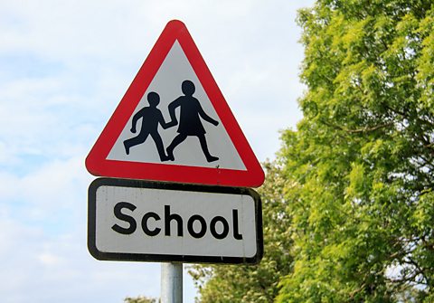 School warning road sign in article about learning to drive and passing theory test