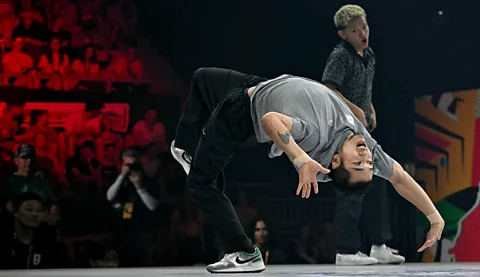 Getty Images South Korea's Hongten bends backwards in a dance move (Credit: Getty Images)