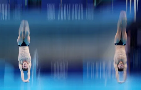 Reuters Anthony Harding and Jack Laugher of Britain during the men's synchronised 3m springboard diving final (Credit: Reuters)