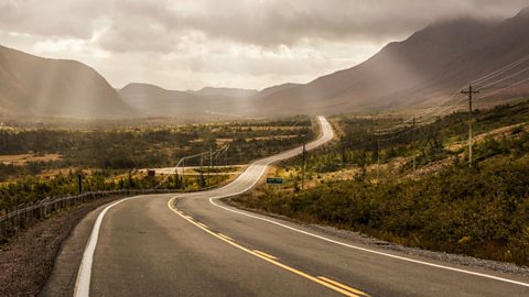 A long winding road heading into the horizon.