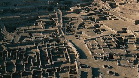 Aerial photo of a closely packed stone ruins of small houses