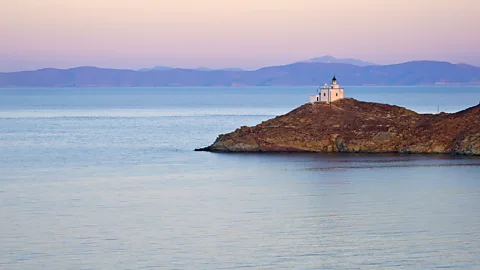 Alamy A lighthouse on the island of Kea surrounded by sea (Credit: Alamy)