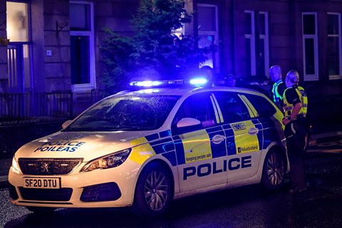 Police Scotland car at night in Glasgow.