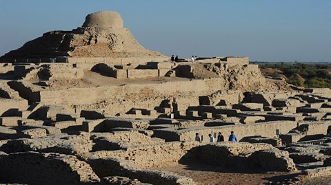 Visitors walk through the UNESCO World Heritage archeological site of Mohenjo Daro