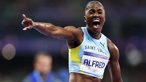 Getty Images Julien Alfred celebrating at the Paris 2024 Olympics (Credit: Getty Images)