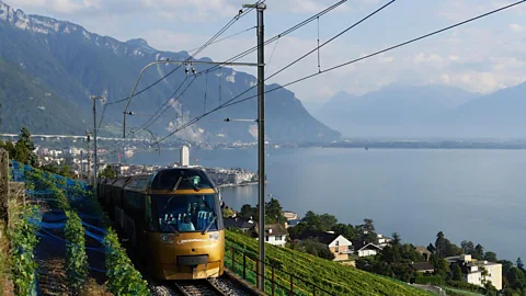 Alamy The GoldenPass Express going by a lake (Credit: Alamy)