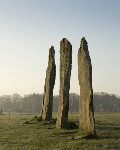 Getty Images The standing stones are thought to be the oldest structures at the site, dating back around 4,000 years (Credit: Getty Images)