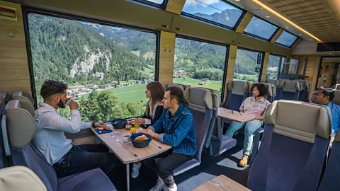 MOB The interior of the midnight blue train features floor-to-ceiling windows (Image credit: MOB)