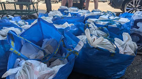 Lucy Sherriff Bags of food, hygiene packs and supplies are lined up ready to be distributed in Koreatown (Credit: Lucy Sherriff)