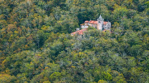 Getty Images The ancient Santa Cristina de Ribas de Sil monastery requires reservations in peak season to manage visitor volume (Credit: Getty Images)