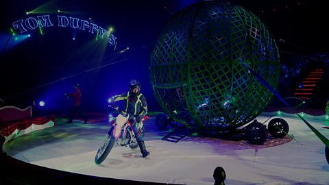 motorcycles and a large cage ball