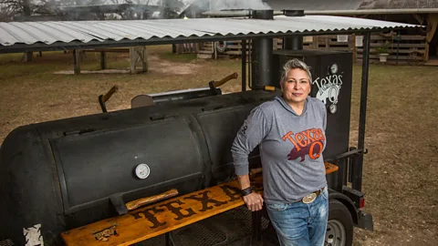 Amanda White Sloan Rinaldi in front of a grill (Credit: Anderson Group)