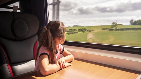 Girl looking out of train window