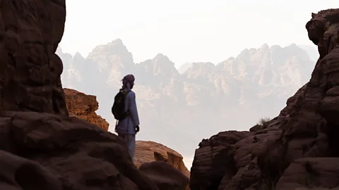 Anthon Jackson Man on a rocky outlook looking at mountains in the distance (Credit: Anthon Jackson)