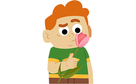 A young boy sniffing a flower and looking confused