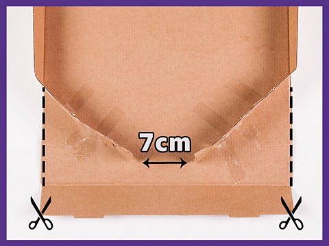 An instruction image showing how to cut a cardboard box to make a pinball machine