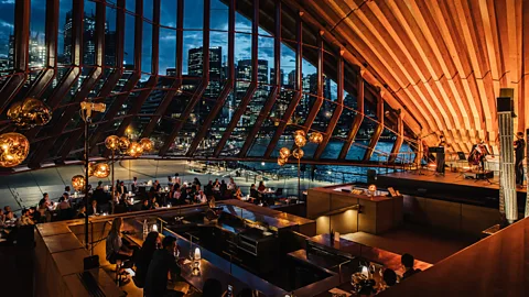 Nikki To Located within the Sydney Opera House, Bennelong's dramatic interior is swathed in ochre, brushed brass and stone (Credit: Nikki To)