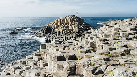 Getty Images The Causeway Coastal Route along Ireland's northern edge takes in the iconic Giant's Causeway (Credit: Getty Images)