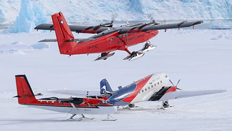 FAZ and Basler Matt Hughes/ BAS The top of the Twin Otter's wings and fuselage are painted black to help snow melt (Credit: FAZ and Basler Matt Hughes/ BAS)