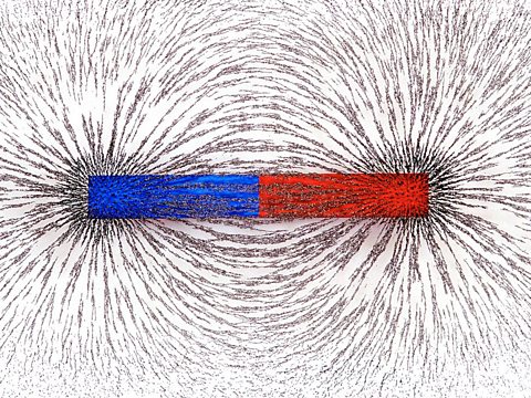 An image of bar fillings being magnetised to a bar magnet