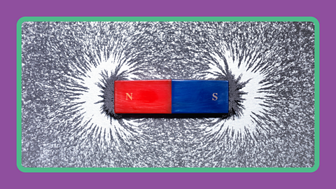 A magnet attracting iron filings 
