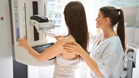 Getty Images A female doctor gives a woman a mammography (Credit: Getty Images)