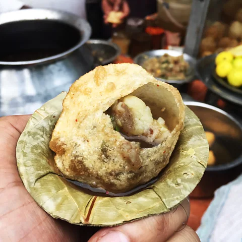 Auroni Mookerjee Crispy, spicy potato-and-chickpea stuffed phuchka is a Kolkata street food staple, and Mookerjee's pick is Dilip da (Credit: Auroni Mookerjee)