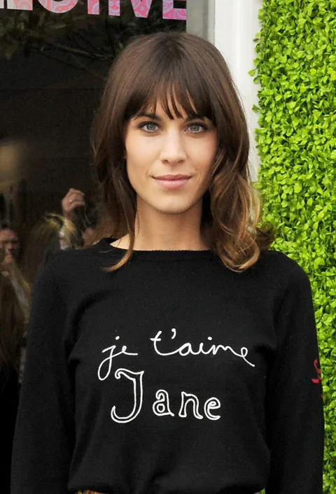 Getty Images The 'Je t'aime Jane' sweater – worn here by Alexa Chung – is among Freud's iconic slogan designs (Credit: Getty Images)