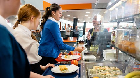 Students paying for their lucnh in the school canteen.