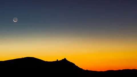 Getty Images Moon and sunlight over hill in Italy (Credit: Getty Images)