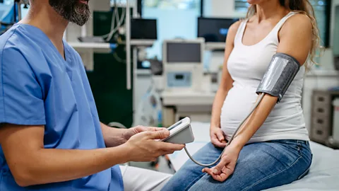 Getty Images A pregnant woman having her blood pressure measured (Credit: Getty Images)